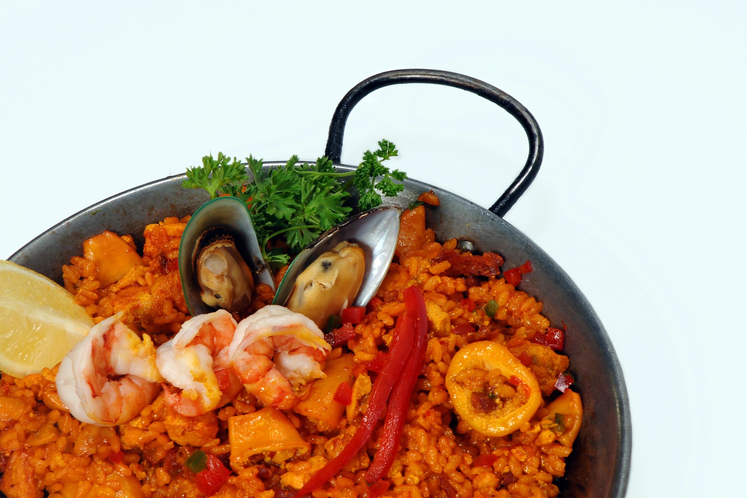 Sea food paella isolated on white